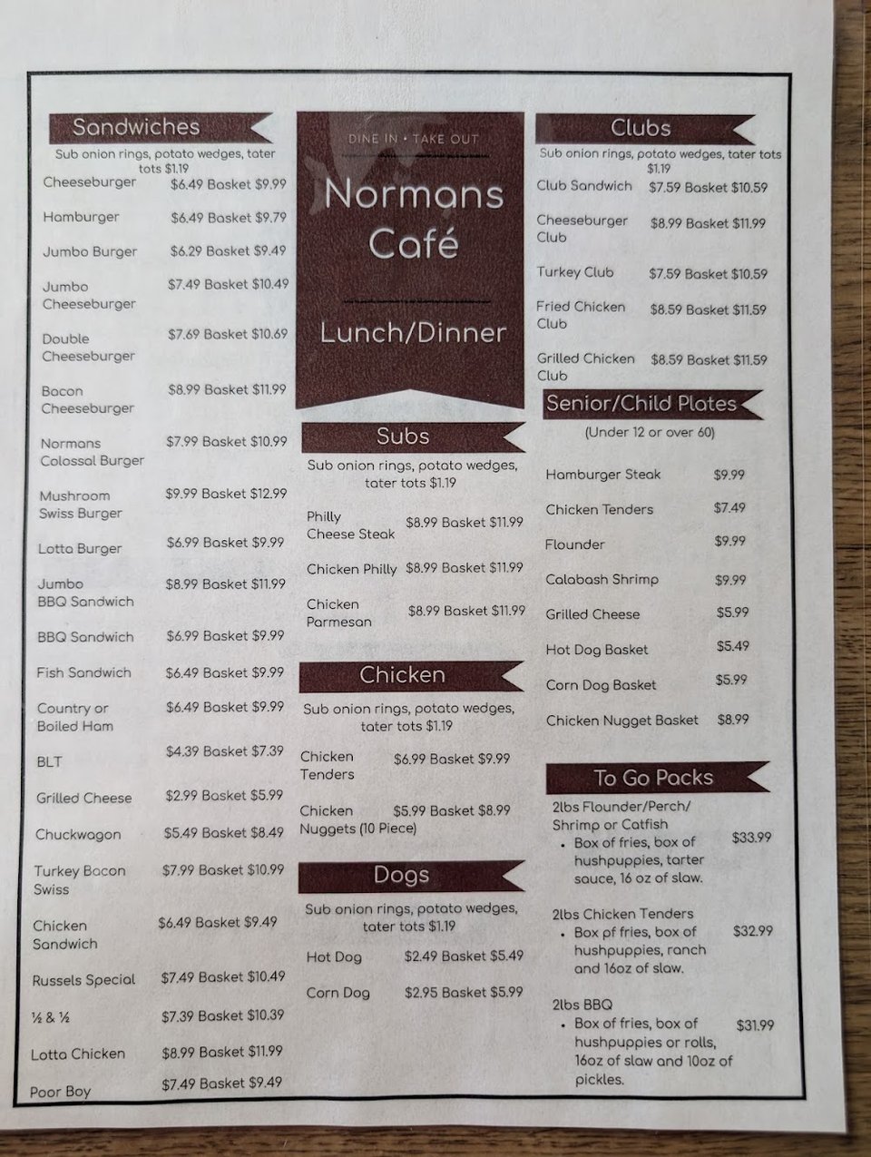 Menu board with breakfast and seafood choices.