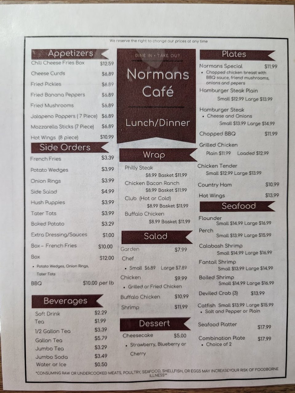 Printed menu showing plates, appetizers, and seafood.